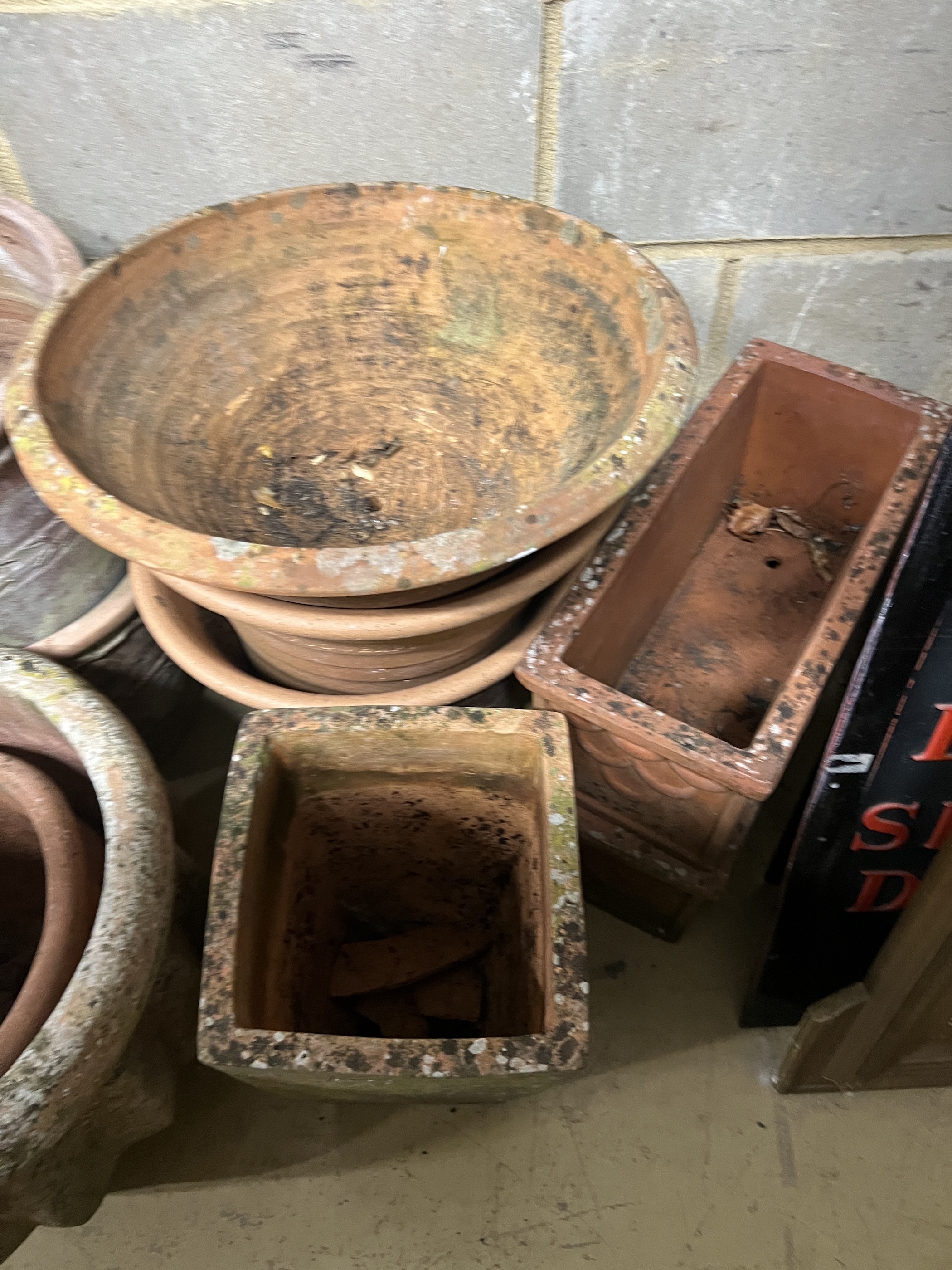 Fourteen assorted terracotta garden planters, largest diameter 42cm, height 40cm
